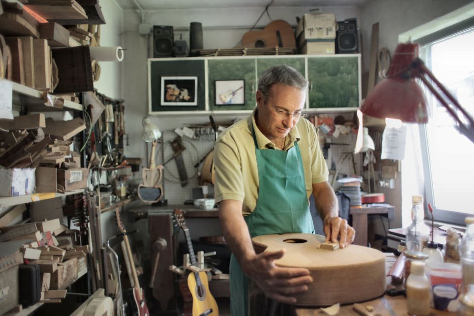 Craftsman working on handmade furniture in workshop